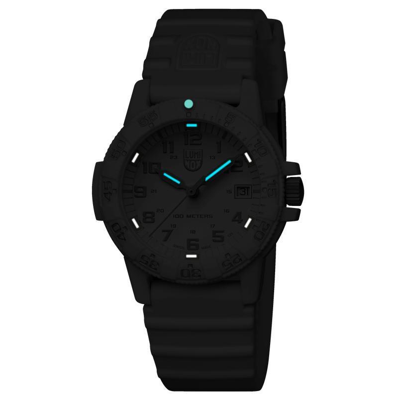 Luminox Leatherback SEA Turtle 39mm watch with matte black carbon case, black silicone strap, and glowing blue illumination.