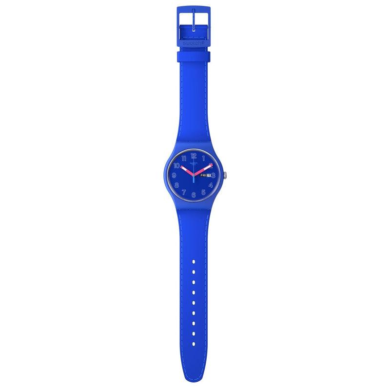 Swatch Cobalt Disco blue biosourced watch with a 41mm matte case, light blue strap stitching, and pink glow-in-the-dark hands.